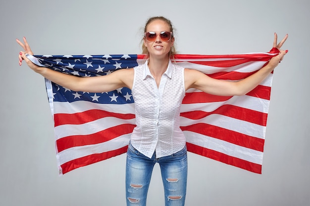 Blonde woman. posing with usa flag