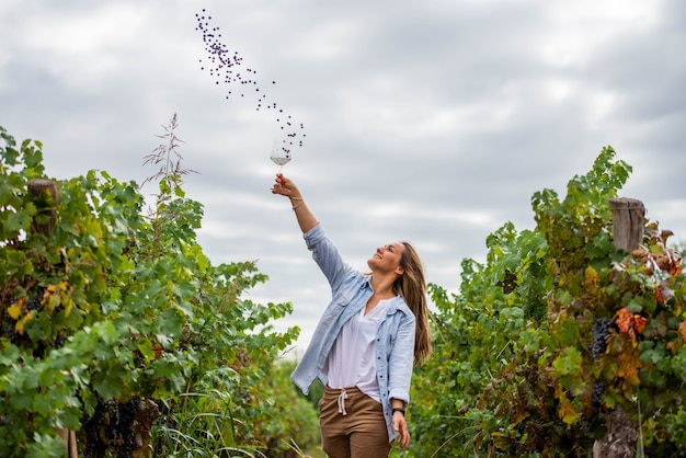 Blonde woman pulling grapes up