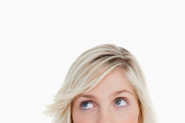 Blonde woman's eyes looking up