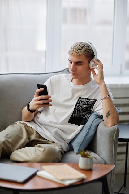 Blonde Young Man Listening to Music