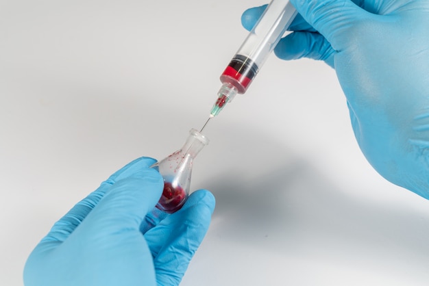 Blood analysis, Doctor with syringe