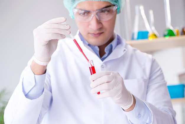 Blood testing in the lab with young scientist