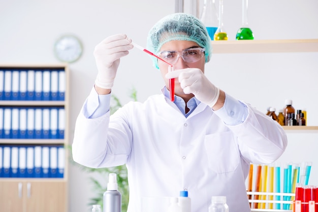 Blood testing in the lab with young scientist