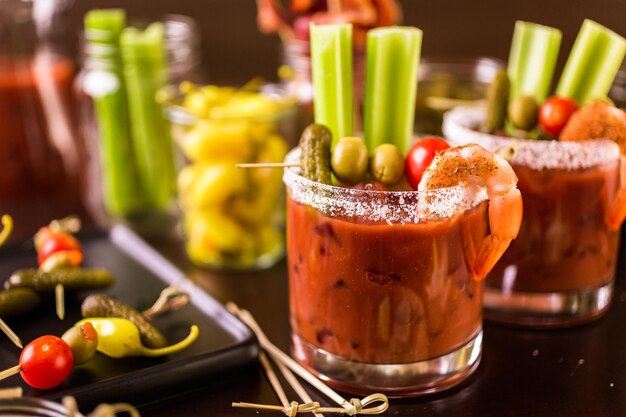 Bloody mary cocktail bar with variety of garnishes.