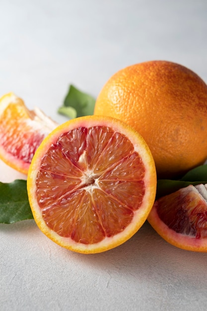 Bloody orange fruits composition. Abstract citrus fruit on bright background.