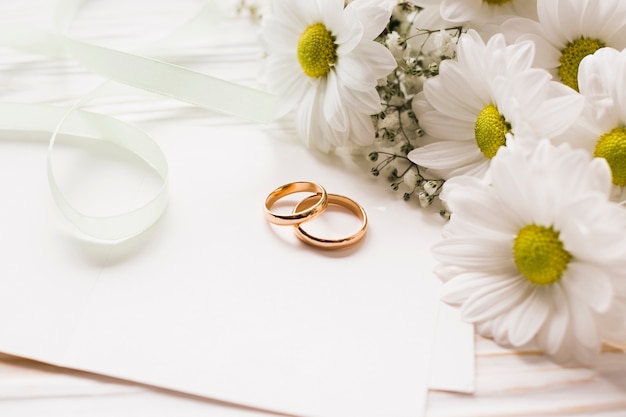 Blooming flowers with engagement rings