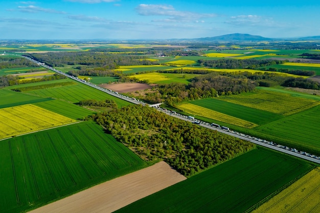 Blooming rapeseed fields in countryside aerial view