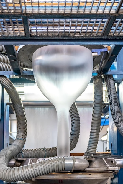 Blowing plastic on a machine into a roll for the production of plastic bags