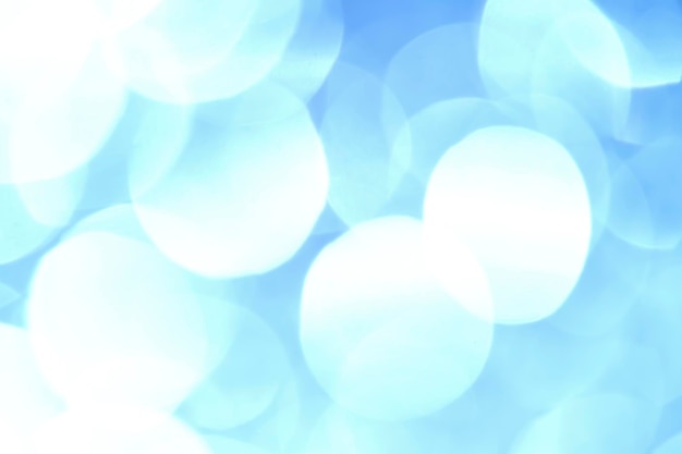 Blue abstract background bokeh blurred beautiful shiny lights Christmas The background is shiny white Divorces and blurry balls of light gray color