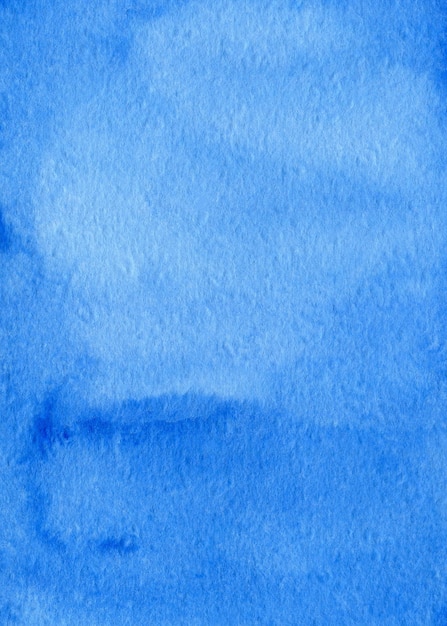 Blue abstract watercolor background on textured paper. Hand made watercolor backdrop