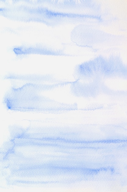 Blue abstract watercolor painting textured on white paper background