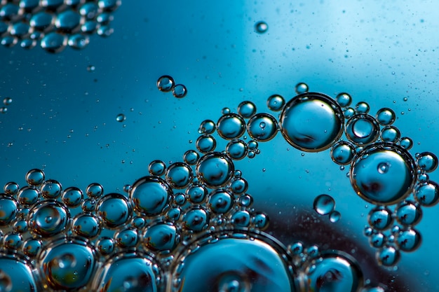 Blue background. Abstract macrophotography. Oil bubbles. Water texture.