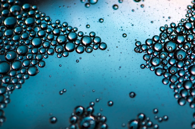 Blue background. Abstract macrophotography. Oil bubbles. Water texture.