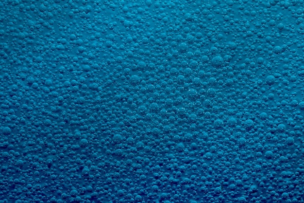 Blue background of oil drops