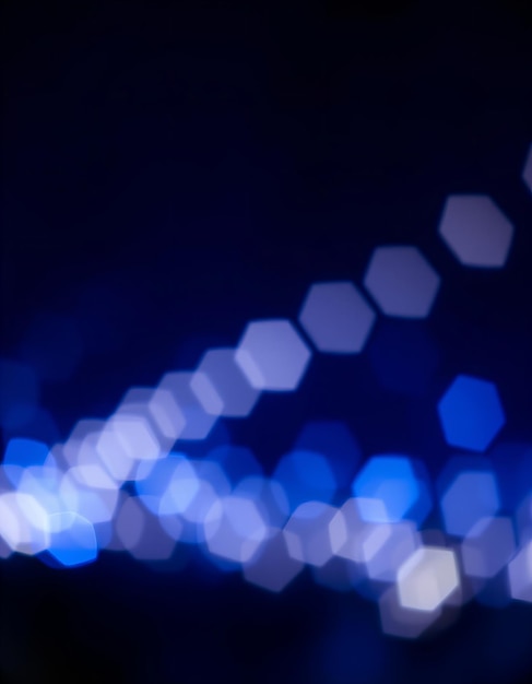 a blue background with a blur of lights and a blur of blue light