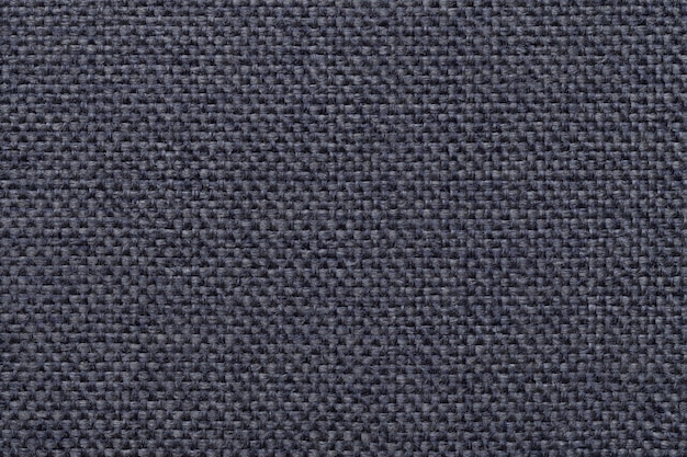 Blue background with braided checkered pattern, closeup.