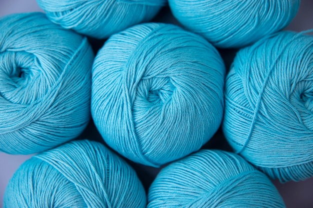 Blue balls of cotton yarn closeup knitting aesthetics