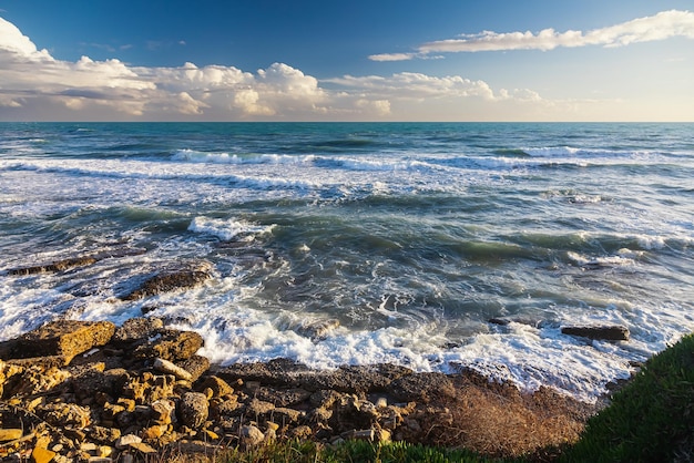 Blue and beautiful waves on background mountain Crest of a sea wave Wonders of nature Beautiful landscape of the winter sea