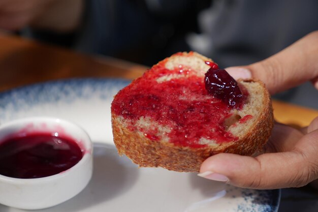 Blue berry jam on bread on table