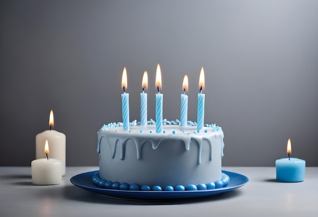 Blue Birthday with lit candles over light grey