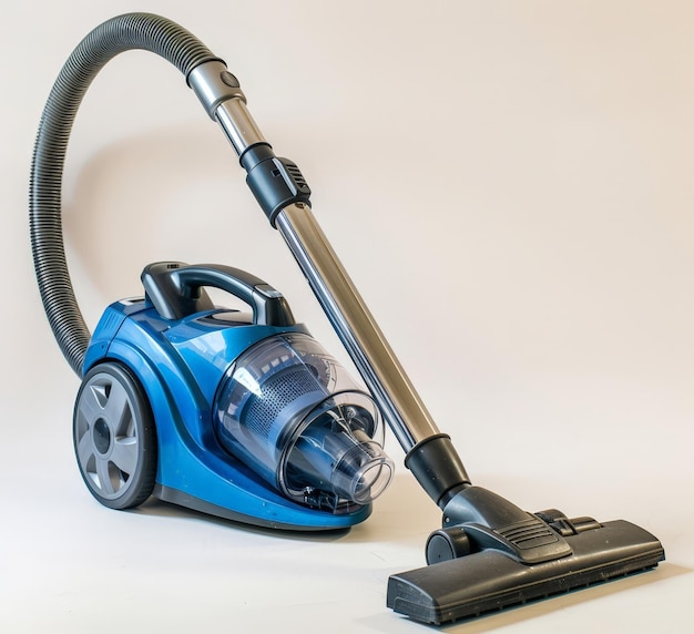 Photo a blue and black oster power tool vacuum cleaner with a grey extension hose