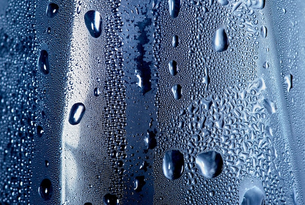 A blue bottle with water droplets on it