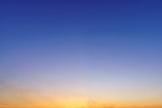 Blue bright dramatic sunset sky in countryside or beach colorful cloudscape texture air background.