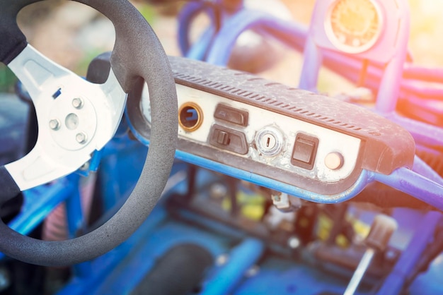 Blue buggy wheel and control panel close up Toned