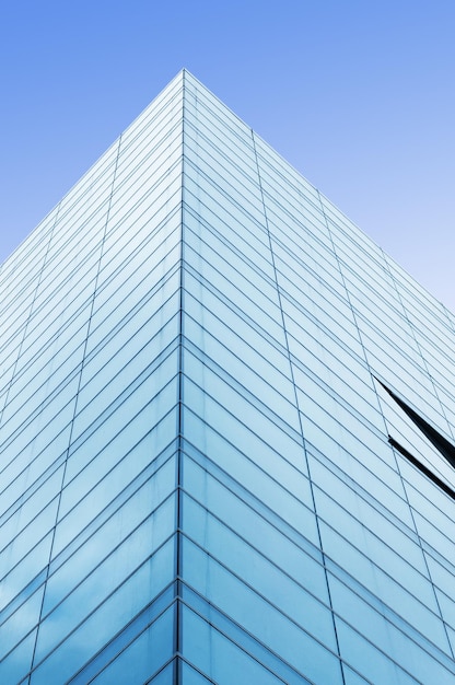 A blue building with a clear sky in the background