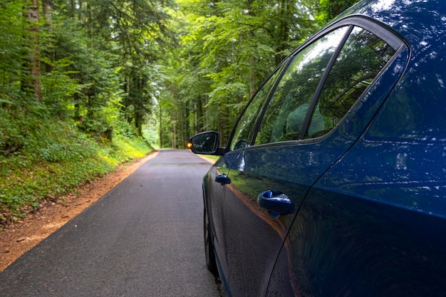 Blue Car on asphalt road on summer day at park Freedom travel concept Summer weekend