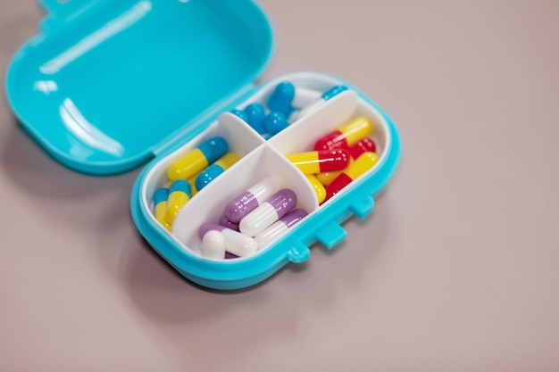 A blue case with different pills in it