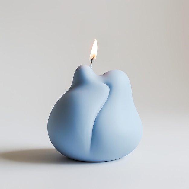 Photo a blue ceramic object with a flame that says the flame