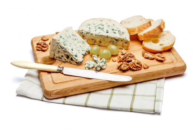 Blue cheese on wooden cutting board