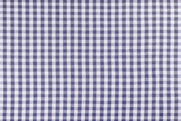 Blue classic checkered tablecloth texture background with copy space