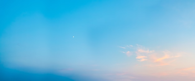 Blue clear sky with moon in the evening ozone layer of the planet wide shot of clouds in the sky at ...