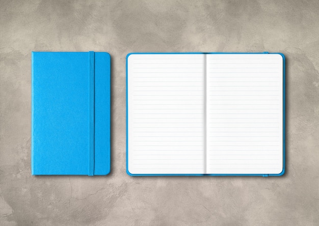 Blue closed and open lined notebooks mockup isolated on concrete background