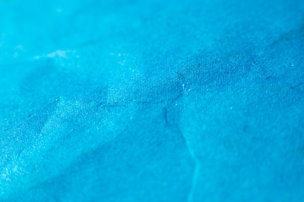 Blue cloth texture close up. Natural material.