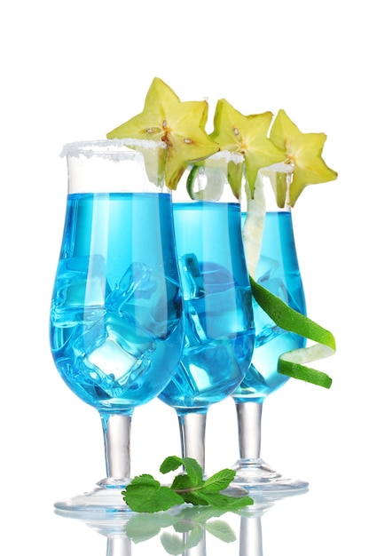 Blue cocktail in glasses with ice and sugar isolated on white