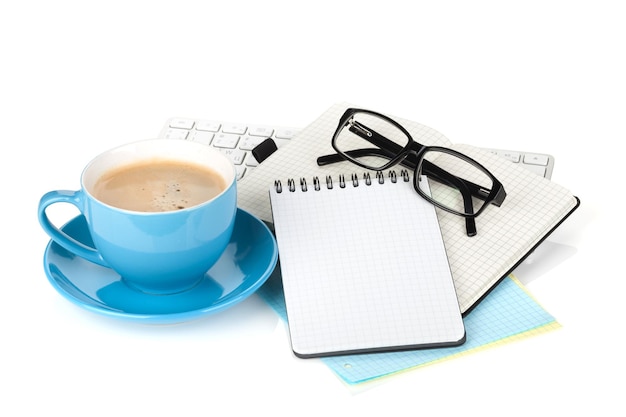 Blue coffee cup glasses and office supplies