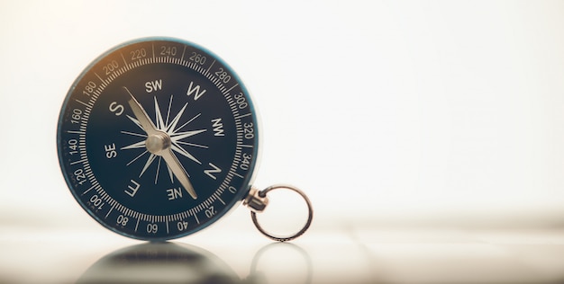 The blue compass is placed on background.