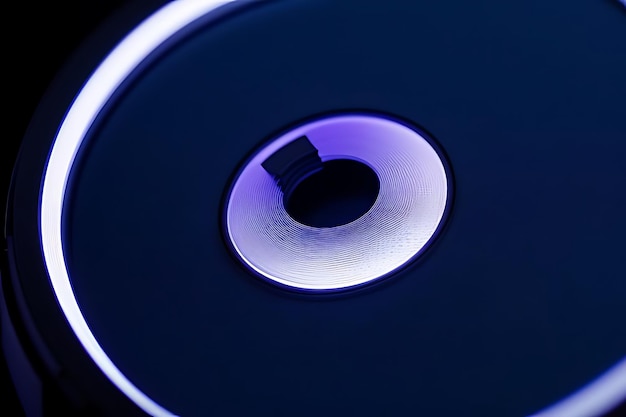 Photo a blue computer mouse with a purple light on it