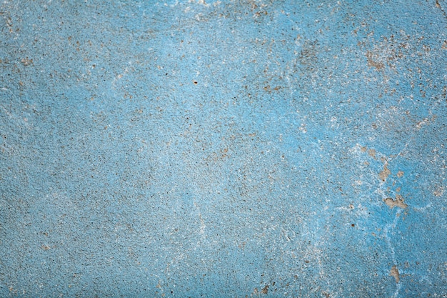 Blue concrete surface with old faded paint Old cement texture