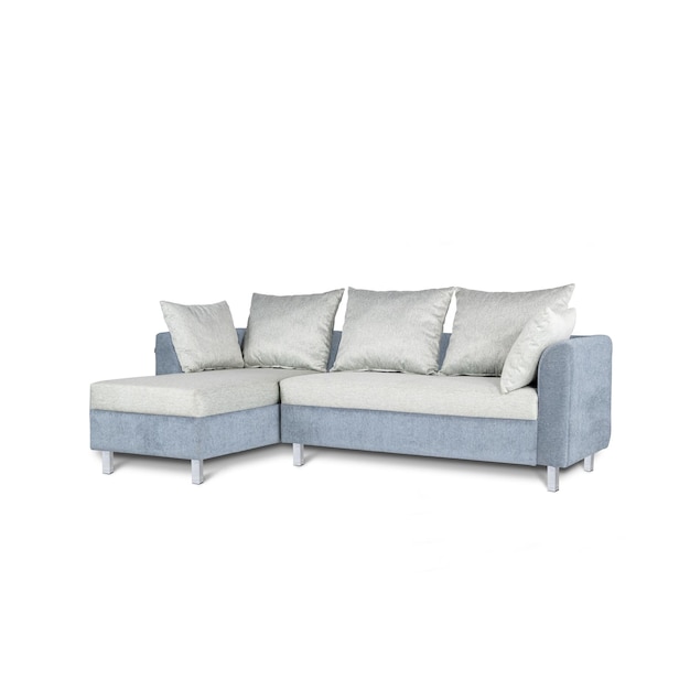 A blue couch with a white pillow on it