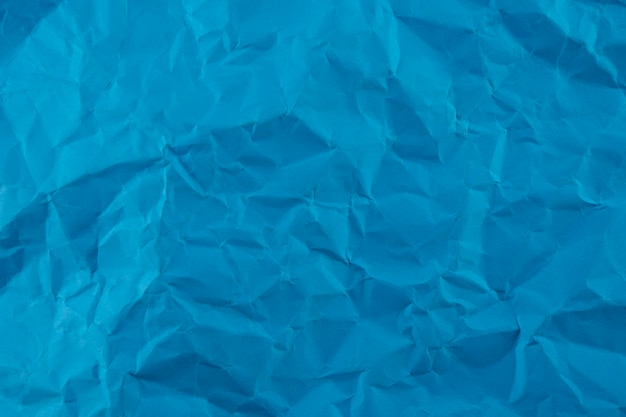 Blue crumpled paper texture background