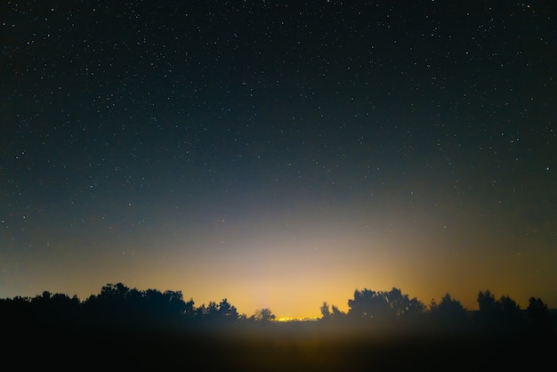 Blue dark night sky with many stars. Space background