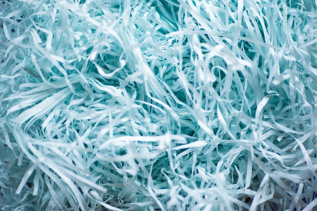 Blue decorative straw closeup. Textural background of blue straw.