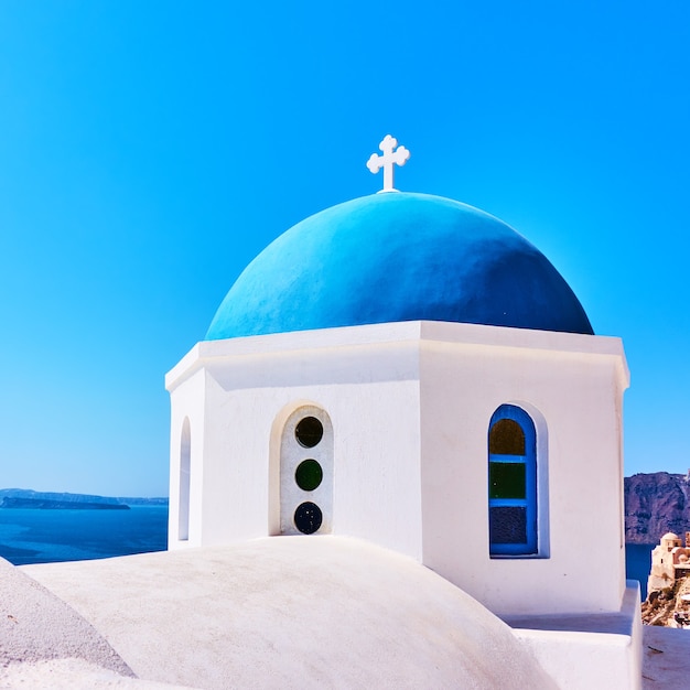 Blue dome of Greek orthodox church in Oia in Santorini island, Greece