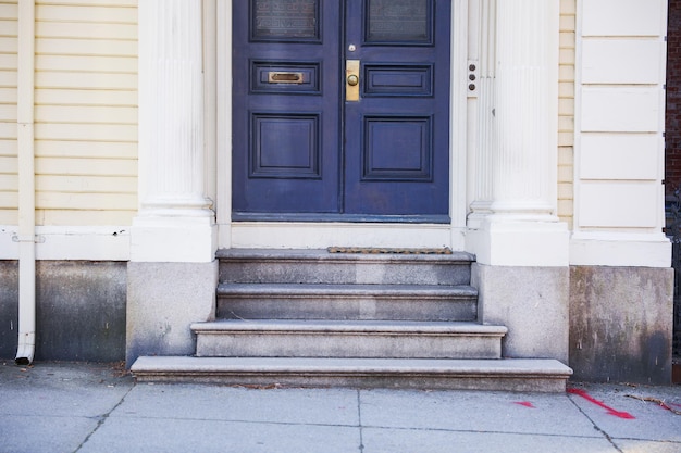 A blue door with a mail slot on it