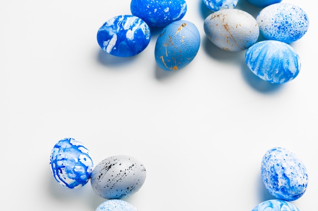 Blue Easter eggs on white background