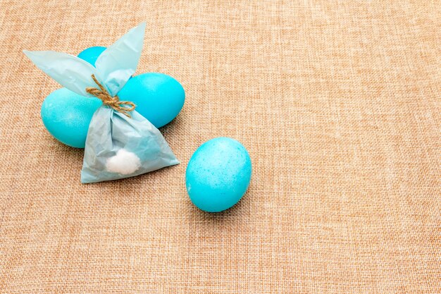 Blue eggs and blue paper bunny for Easter